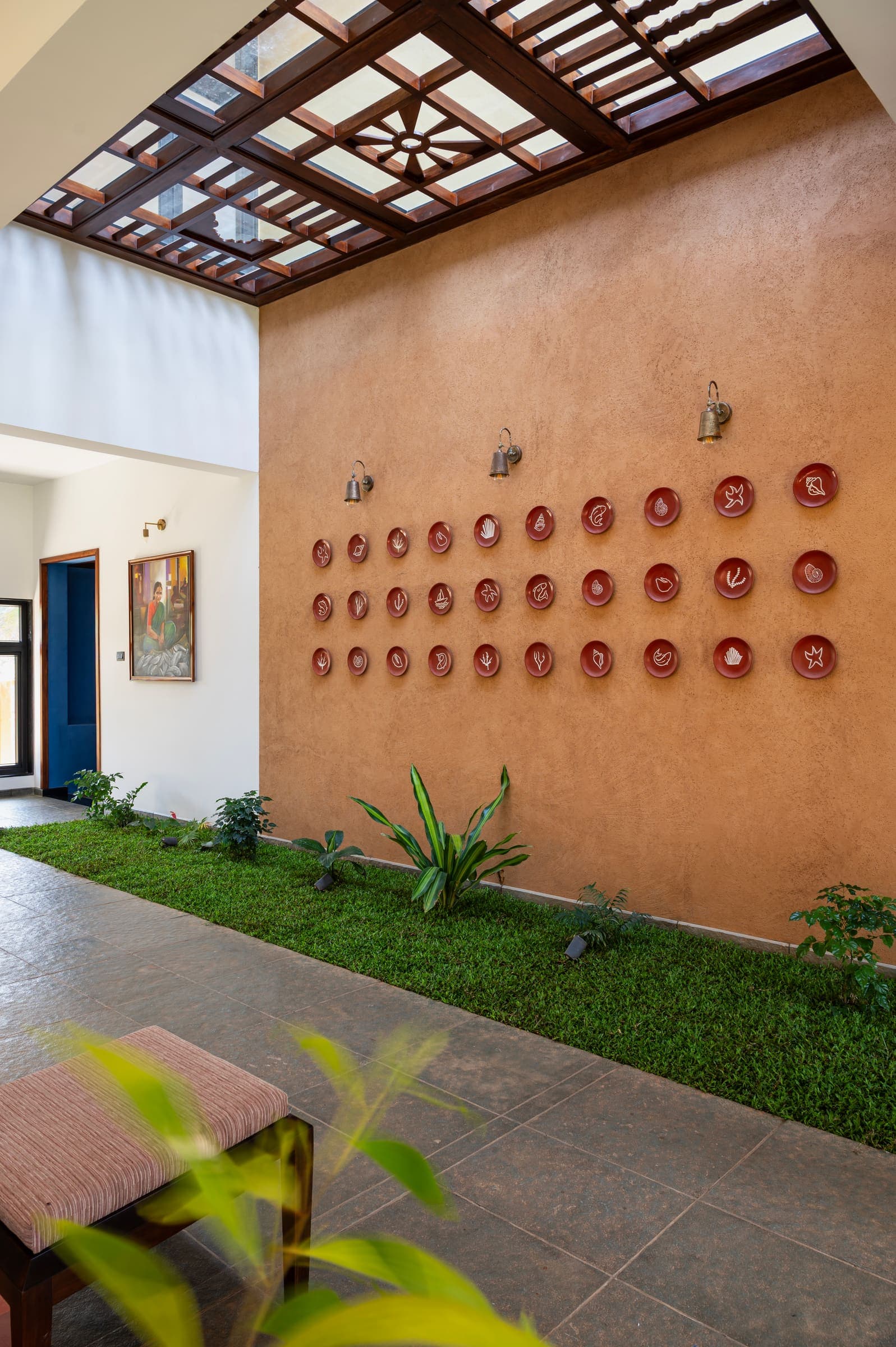 The living room opening onto the sunlit courtyard