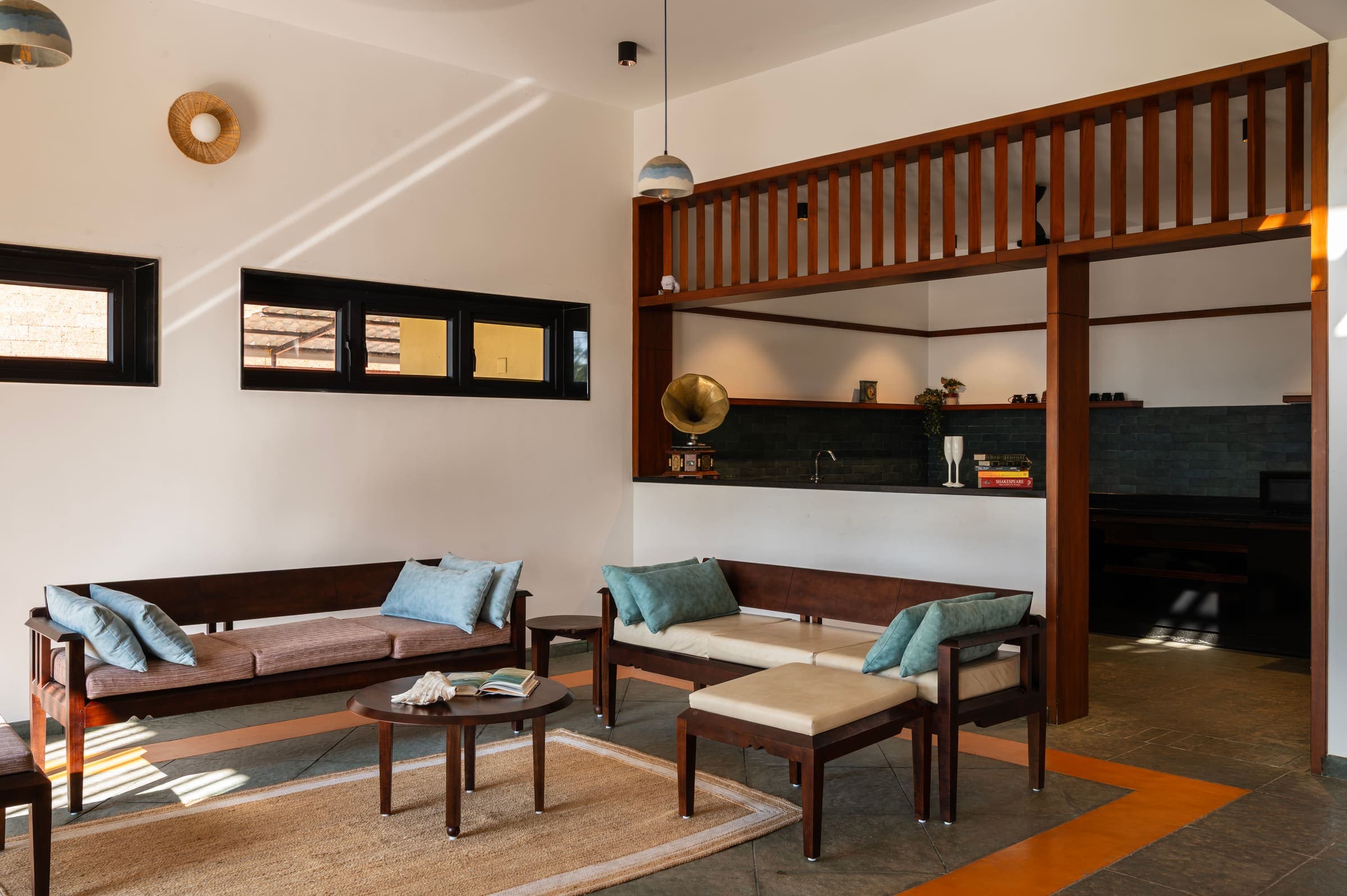 The living room and open kitchen under the wooden mezzanine